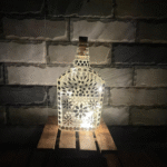 Illuminate Your Space: Bottle Art with Mirror Stickers and Lights