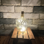 Illuminate Your Space: Bottle Art with Mirror Stickers and Lights