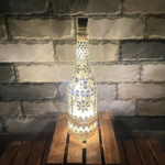 Illuminate Your Space: Bottle Art with Mirror Stickers and Lights