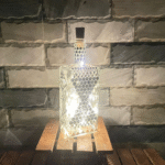 Illuminate Your Space: Bottle Art with Mirror Stickers and Lights