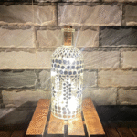 Illuminate Your Space: Bottle Art with Mirror Stickers and Lights